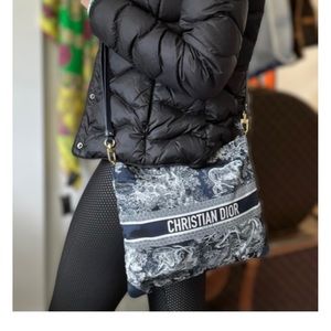 Authentic Christian Dior purse. Never used, in box with tags. No imperfections.